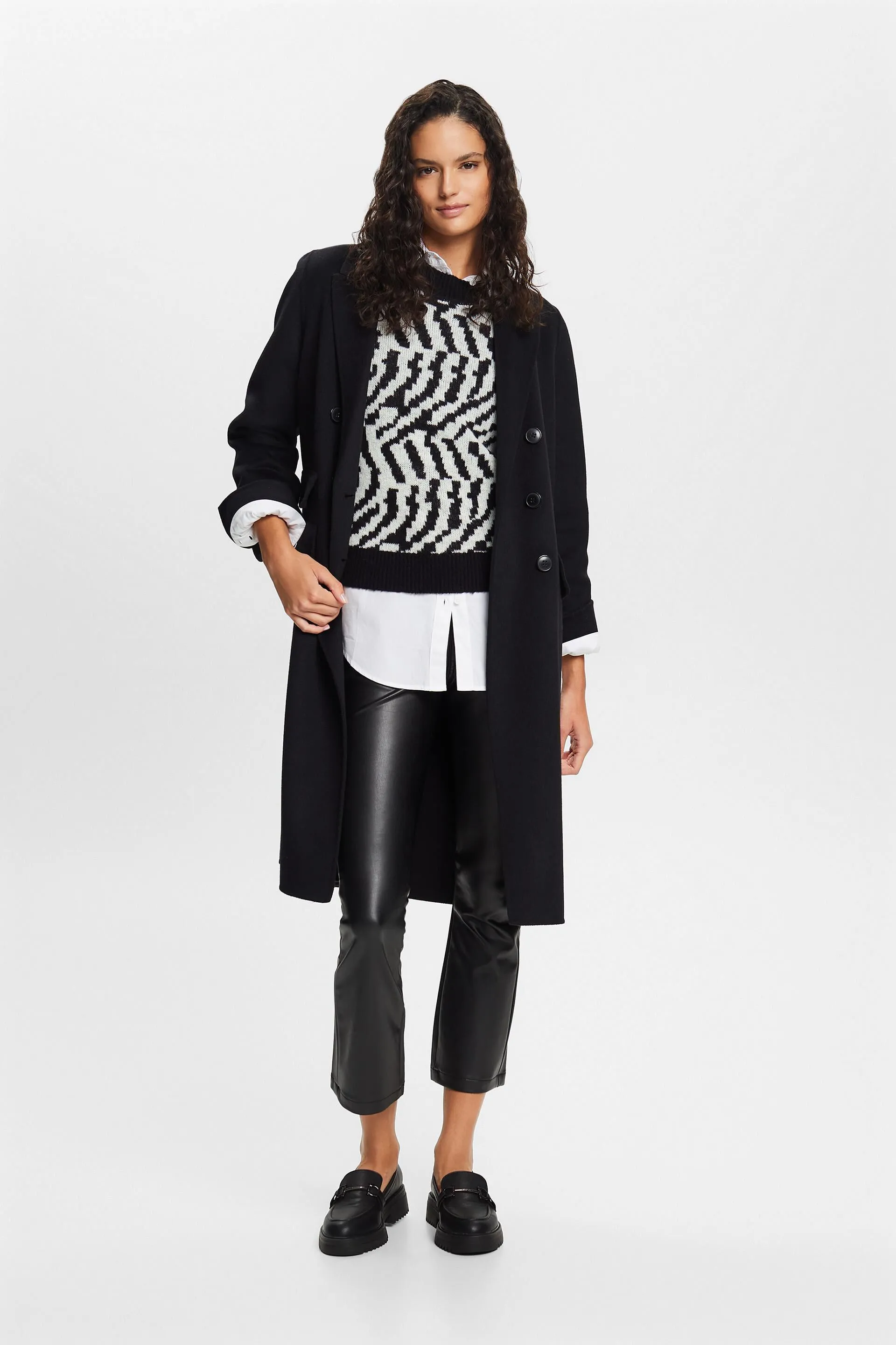 Pantaloni in similpelle a zampa